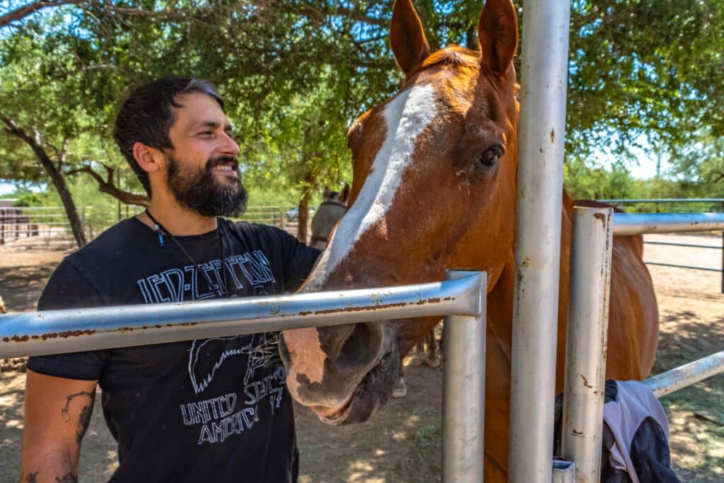 Man healing through our equine therapy program in Tucson, Arizona
